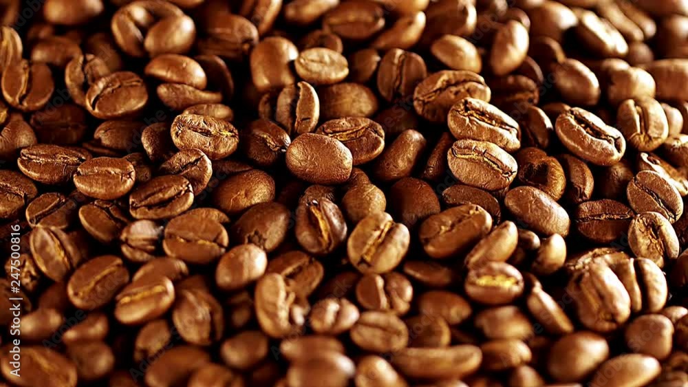 Coffee beans rotation in the slowed-down movement macro. Coffee beans rotation in the slowed-down movement macro.