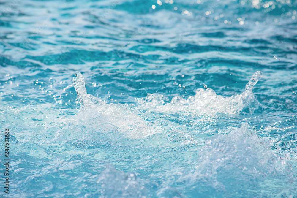 The blue water waves by wind and sunlight reflecting surface The blue water waves by wind and sunlight reflecting surface