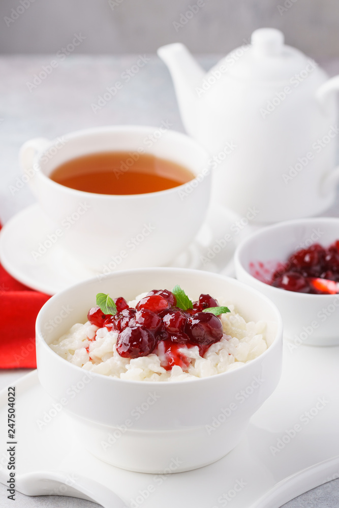 Rice porridge or pudding with caramelized cranberries and mint. Rice porridge or pudding with caramelized cranberries and mint.