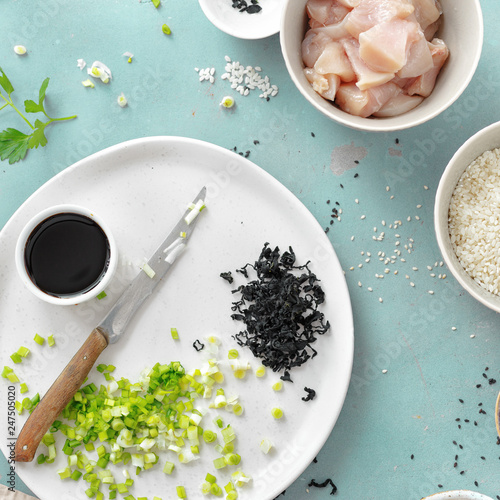 Various raw Ingredients cooking poke bowl chicken meat kitchen table top view photo