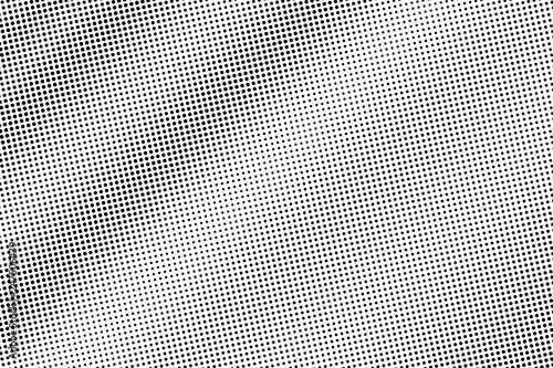 Black on white halftone vector texture. Small perforated surface. Diagonal dotwork gradient. Digital pop art background