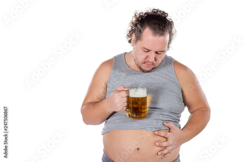 Funny fat man feeling happy and relaxed, holding fresh cold beer in his hands on white background