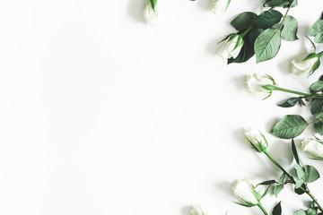 Flowers composition. White rose flowers on white background. Flat lay, top view, copy space