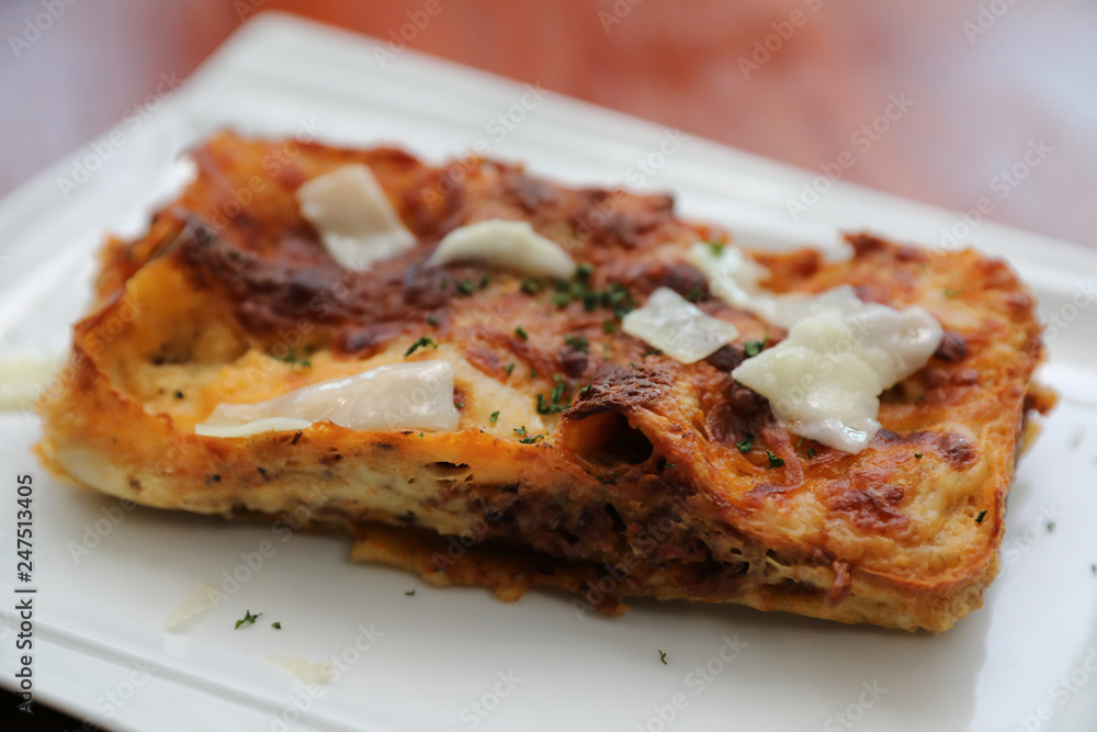 Beef lasagna on wooden background , Italian food Beef lasagna on wooden background , Italian food