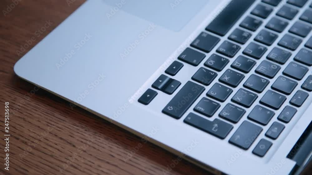 laptop in a new design on a wooden table. laptop in a new design on a wooden table.
