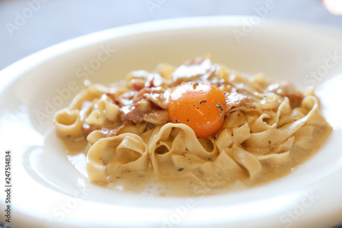 Homemade pasta with white sauce , spaghetti carbonara , italian food