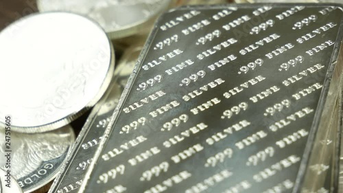 Panning across silver bars and coins