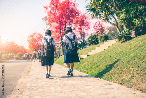 The female high school students are going back home after school in Thailand, southeast Asia.