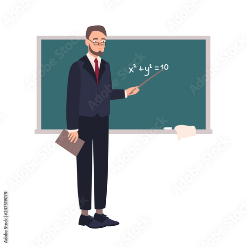 Smiling school mathematics teacher or university professor standing beside chalkboard and demonstrating equation