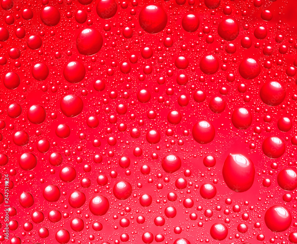 Abstract red background. Liquid on glass. Abstract red background. Liquid on glass.