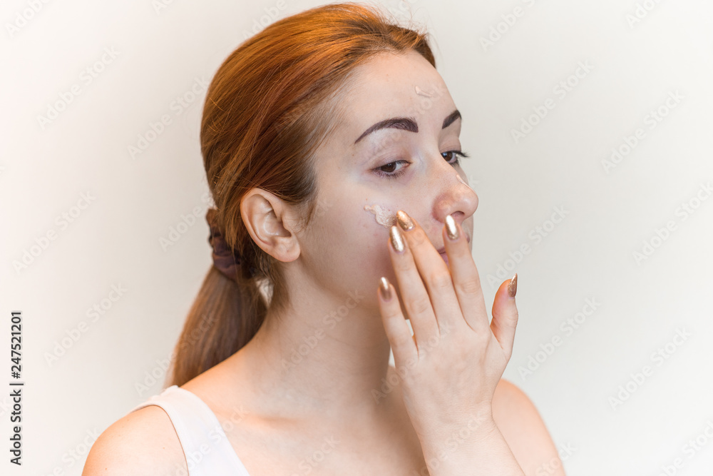 Woman uses concealer on face, acne skin problem, face make up covered and Concept of skin problems  