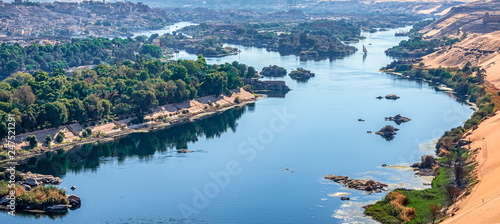 Sunset over the Nile River in the city of Aswan with sandy and deserted shores