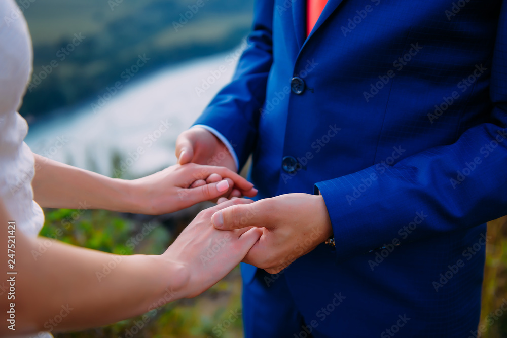 Fototapeta premium wedding theme, holding hands newlyweds