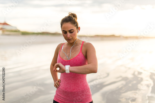 Female runner checking her watch