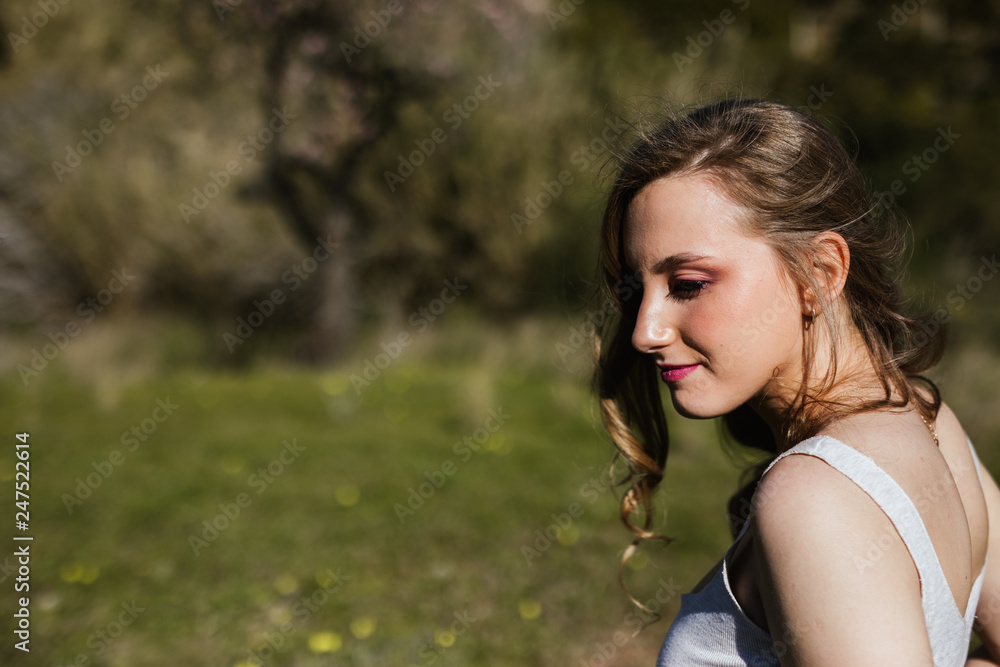 Young Russian girl enjoys spring sun in the countryside Young Russian girl enjoys spring sun in the countryside