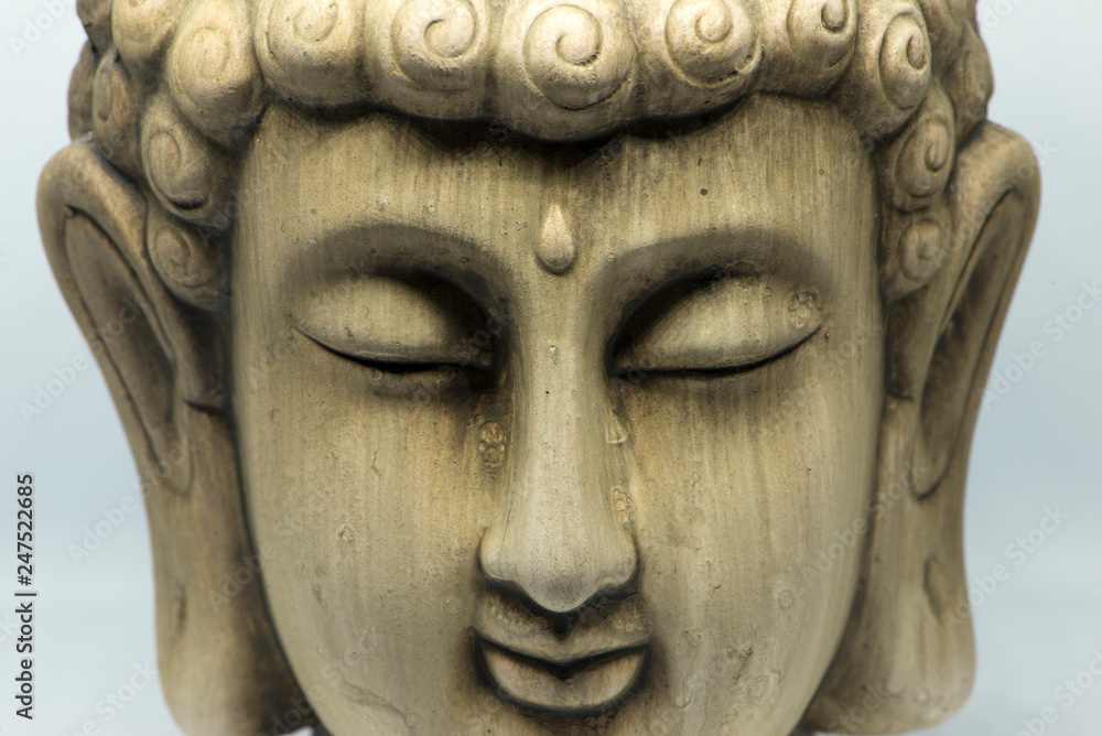 The face of a buddha figure meditating