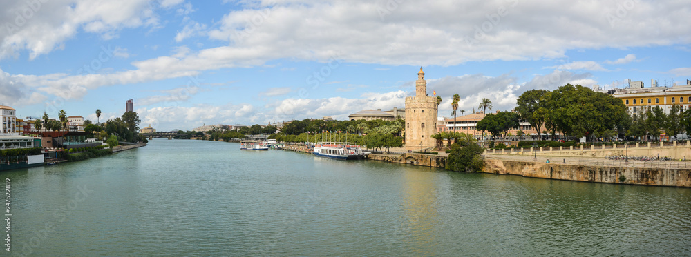 Panorama of Seville, the Golden Tower and the embankment.