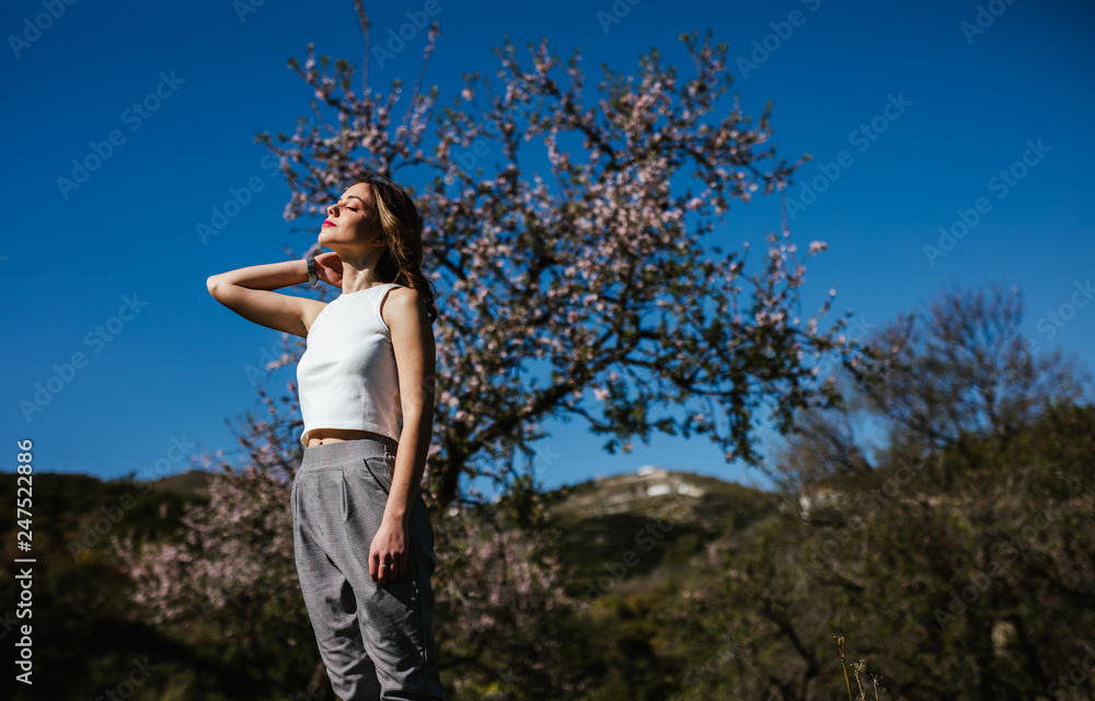 Young Russian girl enjoys spring sun in the countryside Young Russian girl enjoys spring sun in the countryside