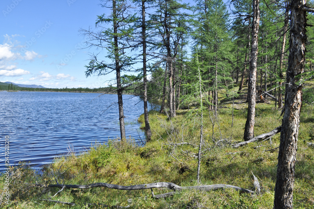Fototapeta premium Photo Northern lake clear: the mountains, the sky, the water.