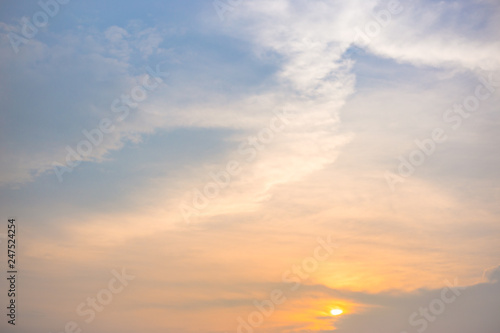 Clouds and sky scene with bright light at sunset