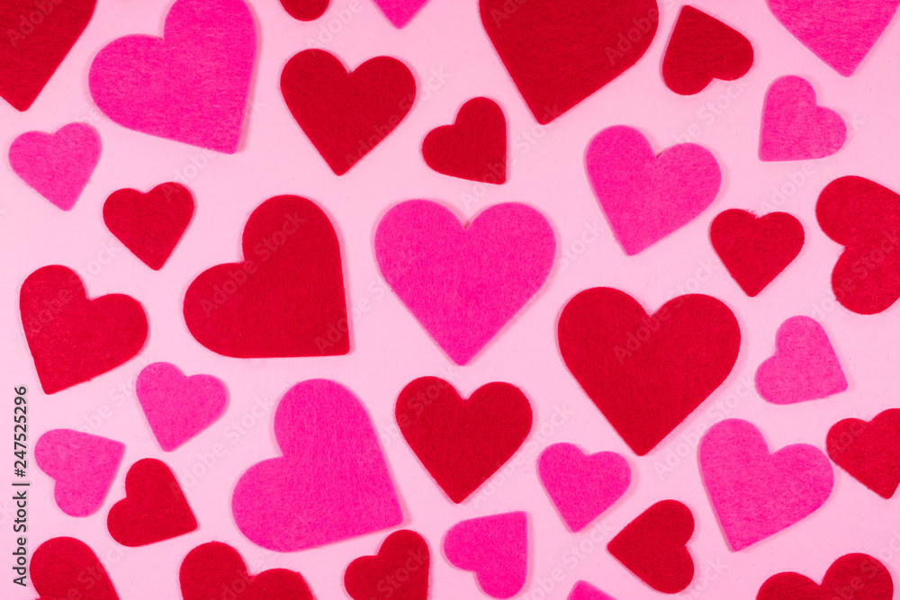Pink Saint Valentine's day background with red and pink hearts