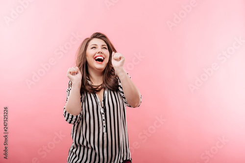 Overweight woman laughing and dancing