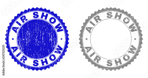 AIR SHOW stamps with grunge texture in blue and grey colors isolated on white background. Vector rubber imitation of AIR SHOW caption inside round rosette. Stamp seals with grunge textures.