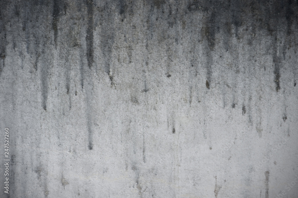 old dirty monochrome background with dripping stain on the wall, detail