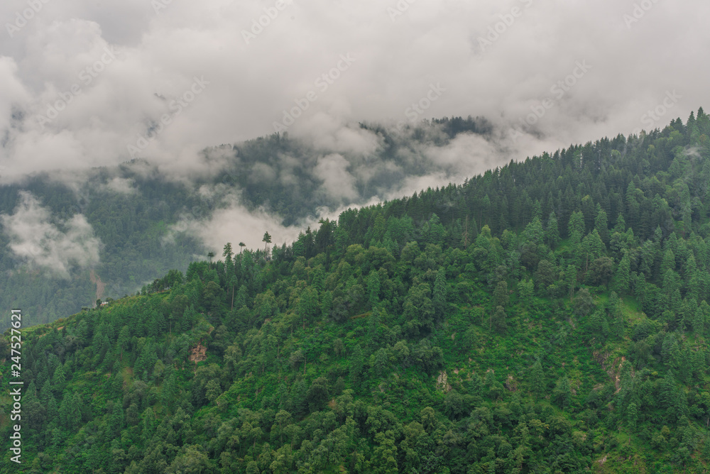 mountain range view. Timelapse Of Moving Clouds And Fog over Himalayan mountain range in Sainj