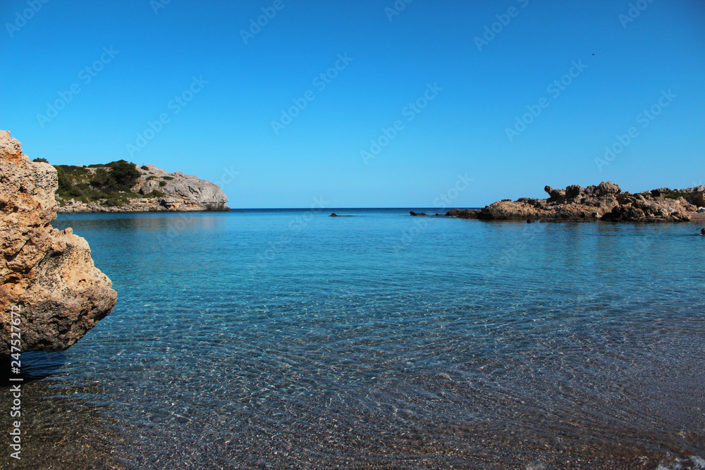 Perfect summer holidays concept, crystal clear sea, sea rocks, blue sky