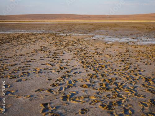 Dry salt lake in our journey. Traces are left by tourists. You can notice the salt  which remains when all the water dries. Such lakes are often in reserves