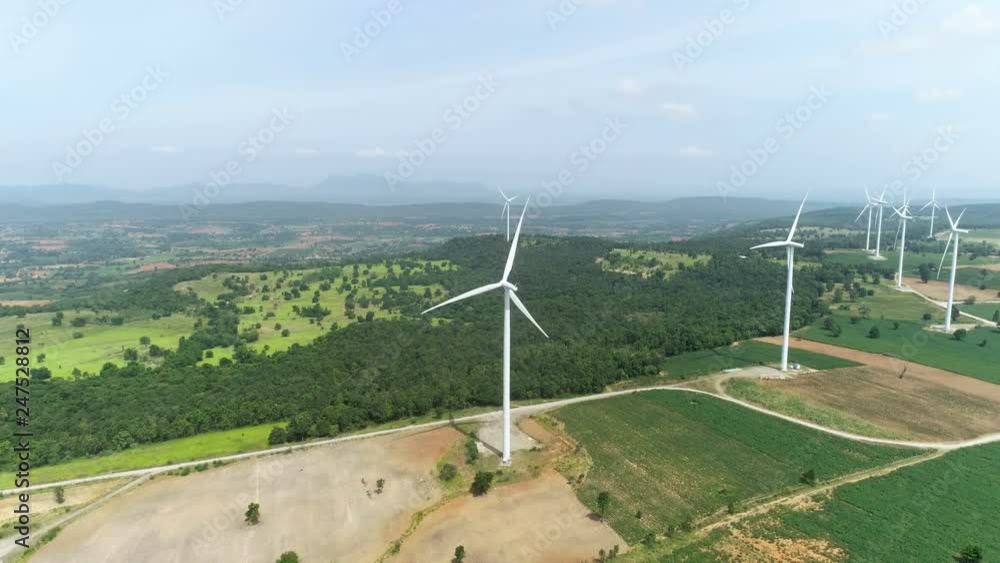 Aerial drone view of wind turbine farm. Green power, environment friendly and renewable energy concept Aerial drone view of wind turbine farm. Green power, environment friendly and renewable energy concept