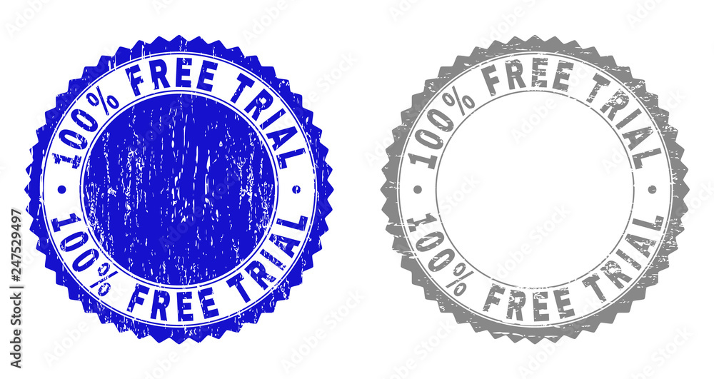 100% FREE TRIAL stamp seals with grunge texture in blue and grey colors isolated on white background. Vector rubber overlay of 100% FREE TRIAL title inside round rosette.