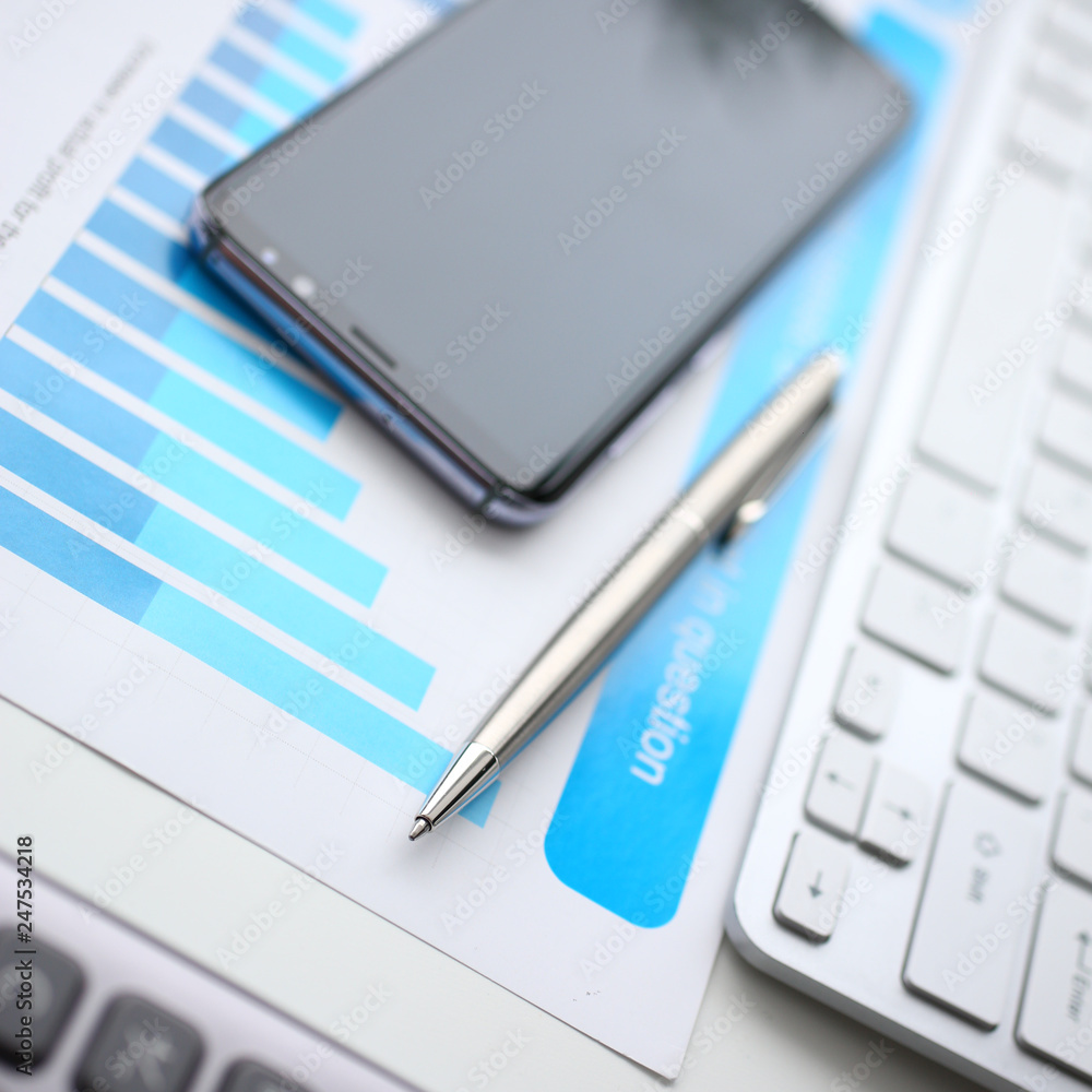Silver calculator and financial statistics on clipboard Silver calculator and financial statistics on clipboard