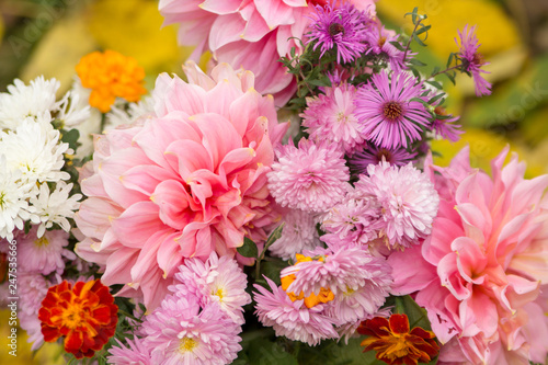 Bouquet of autumn flowers beautiful flowers fall on a yellow background