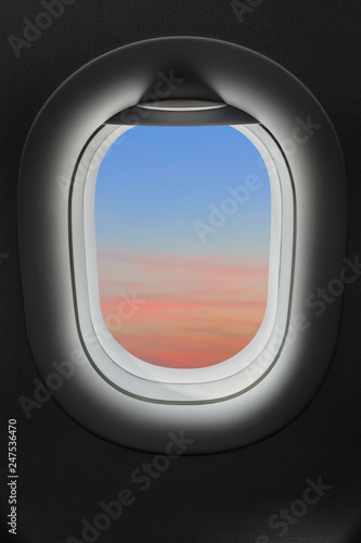 Sunset sky in airplane window