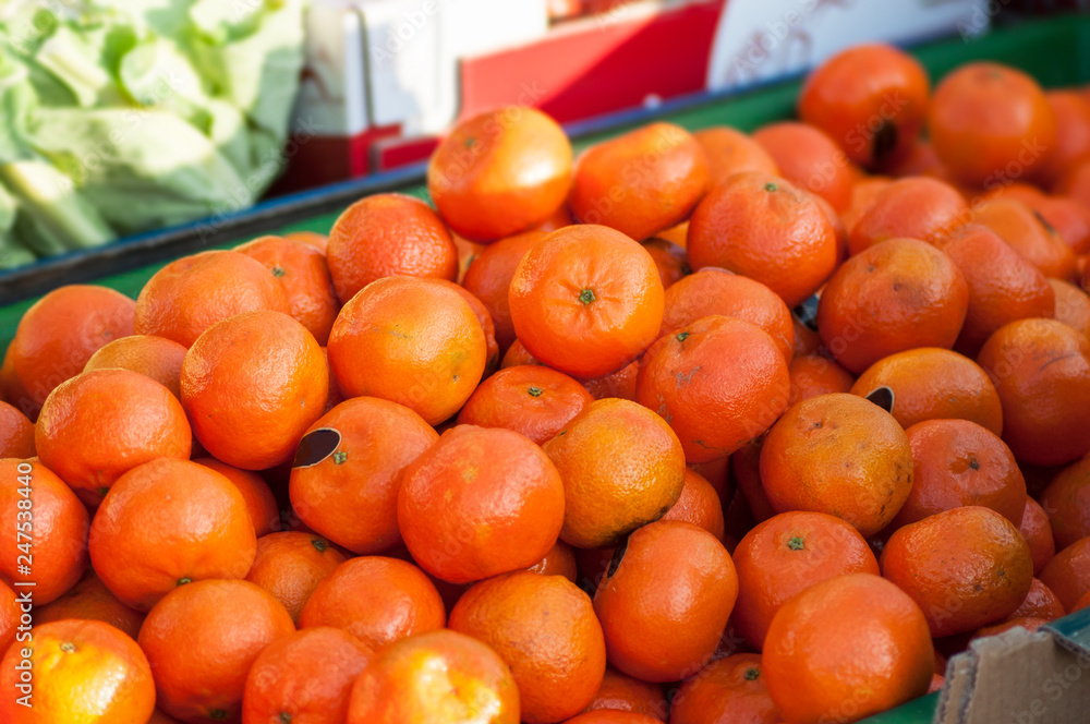 closeup of organic tangerines at the market