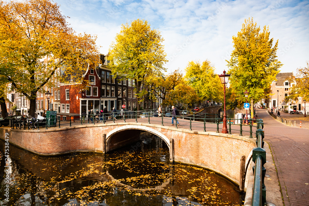 postcard picture of beautiful canals and traditional Dutch buildings in Amsterdam, the Netherlands
