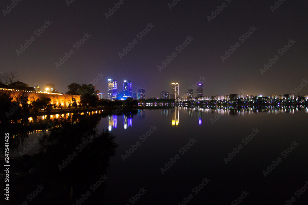 City landscape of Nanjing at night from lake City landscape of Nanjing at night from lake