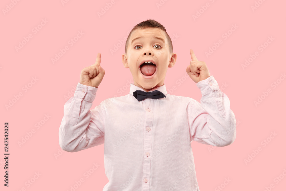 Do not miss. Young casual boy shouting. Shout. Crying emotional teen screaming on pink studio background. The male half-length portrait. Human emotions, facial expression concept. Trendy colors Do not miss. Young casual boy shouting. Shout. Crying emotional teen screaming on pink studio background. The male half-length portrait. Human emotions, facial expression concept. Trendy colors