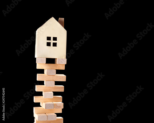house standing on a unstable base concept of real estate invesetment