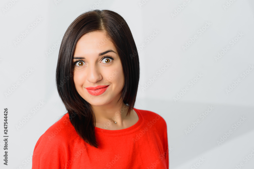 brunette surprised cheerful young woman wearing red brunette surprised cheerful young woman wearing red