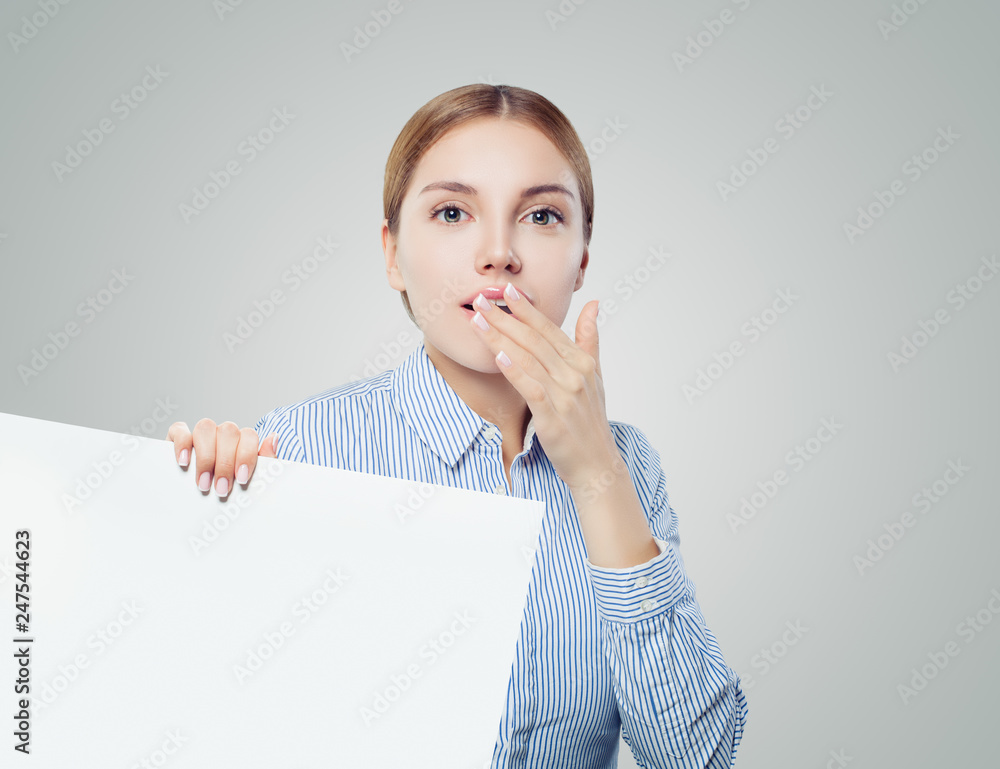 Surprised young woman businesswoman or student showing white empty board background with copy space for seo, advertising marketing or product placement Surprised young woman businesswoman or student showing white empty board background with copy space for seo, advertising marketing or product placement