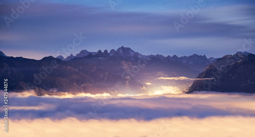 Belluno mountains above clouds at sunset