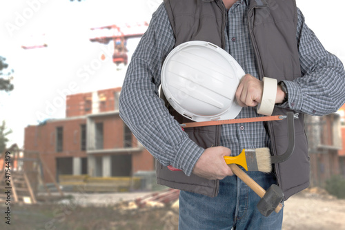 detail worker man with helmet hat front building and cranes under construction site © OceanProd