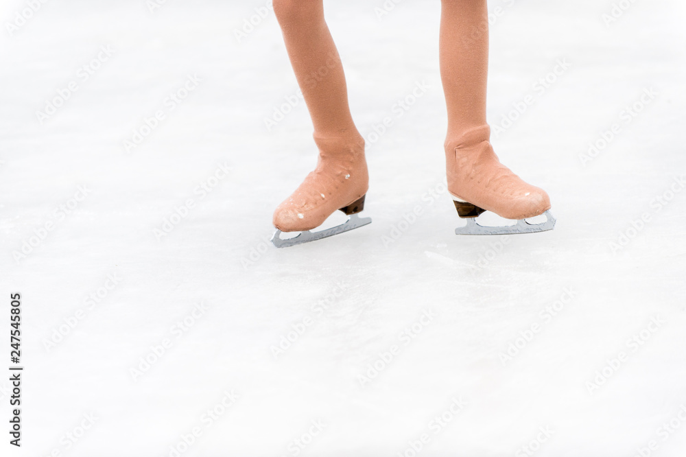 slender legs of girl skate. competitions in figure skating, performance of young athletes slender legs of girl skate. competitions in figure skating, performance of young athletes