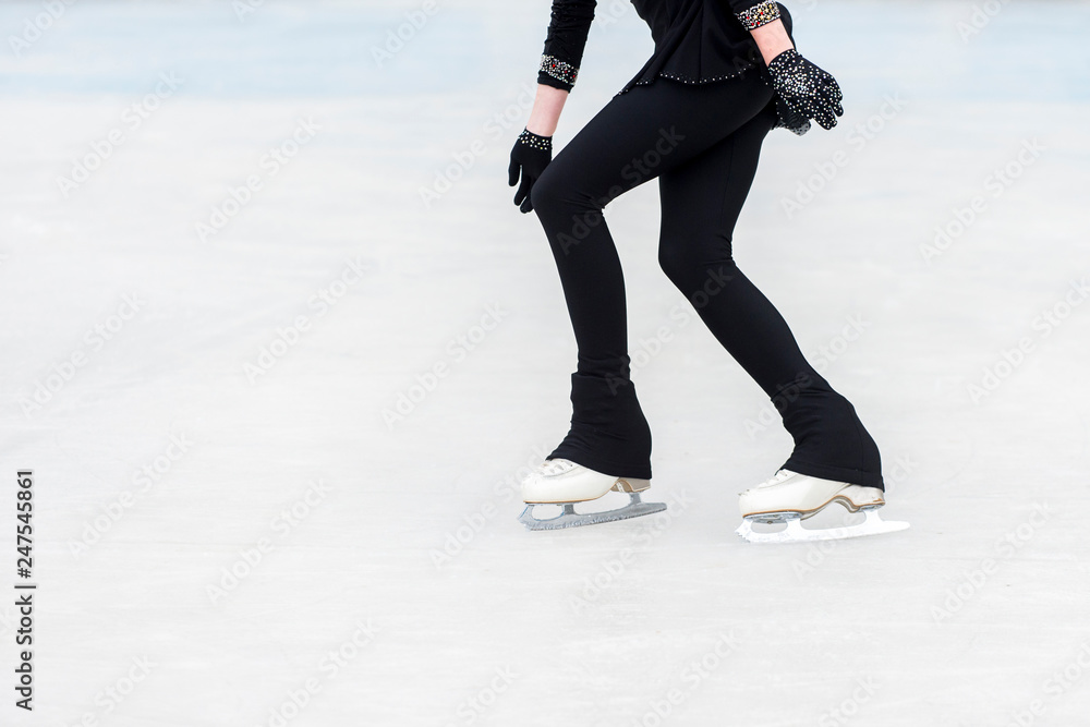 slender legs of girl skate. competitions in figure skating, performance of young athletes slender legs of girl skate. competitions in figure skating, performance of young athletes