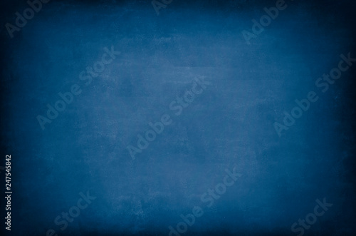 Dark Blue Blackboard. Messy scratchy chalkboard texture as background.