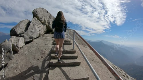 A girl climbing the Moro Rock in Sequoia National Park, California, USA