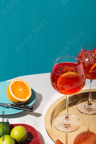 Spritz veneziano, an IBA cocktail, with Prosecco or white sparkling wine, bitter, soda, ice and a slice of orange, in a calix on a table, pop graphic style photo